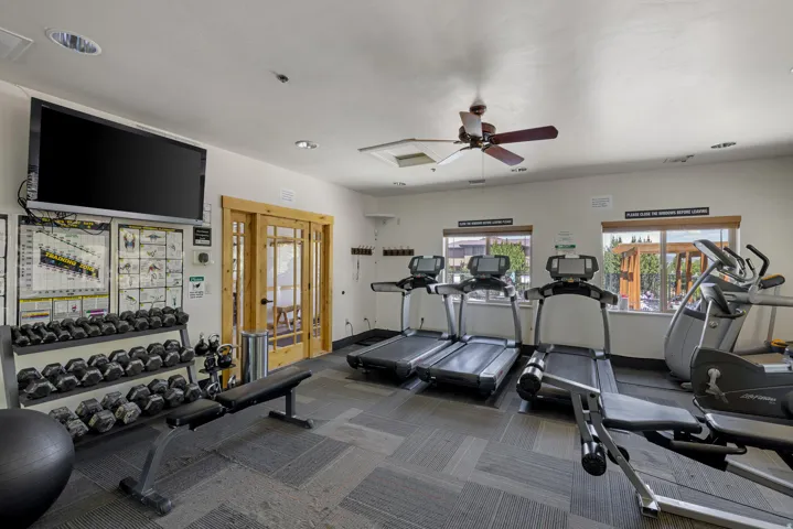 Workout area with a ceiling fan