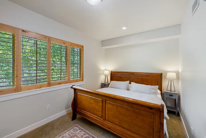 Carpeted bedroom featuring baseboards