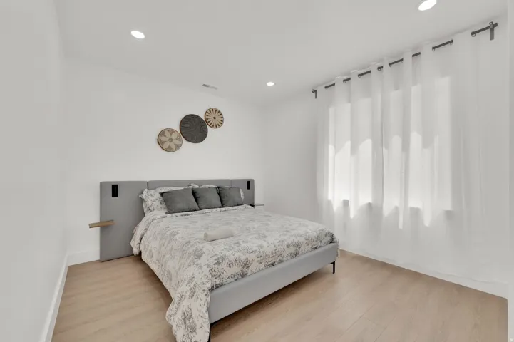 Bedroom featuring light wood-style floors and recessed lighting