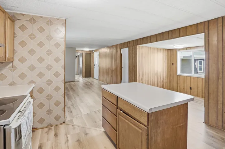 Kitchen featuring a kitchen island,Opening space for your dinning table.