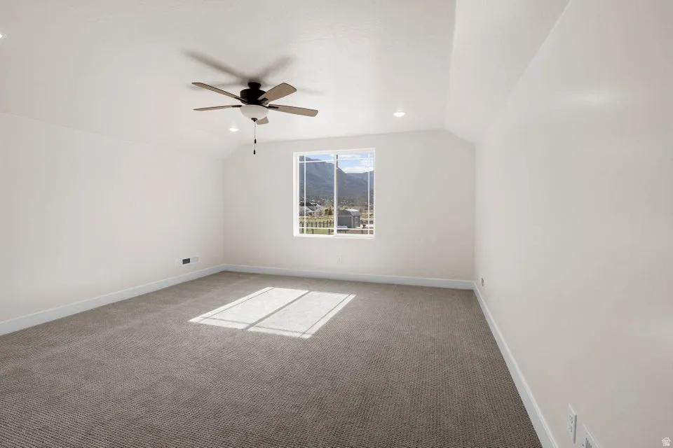 Bonus room featuring carpet flooring, vaulted ceiling, a ceiling fan, and recessed lighting