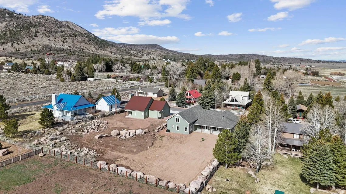 Aerial perspective of suburban area featuring a mountain backdrop