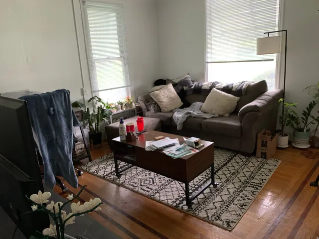 Living room with hardwood / wood-style flooring