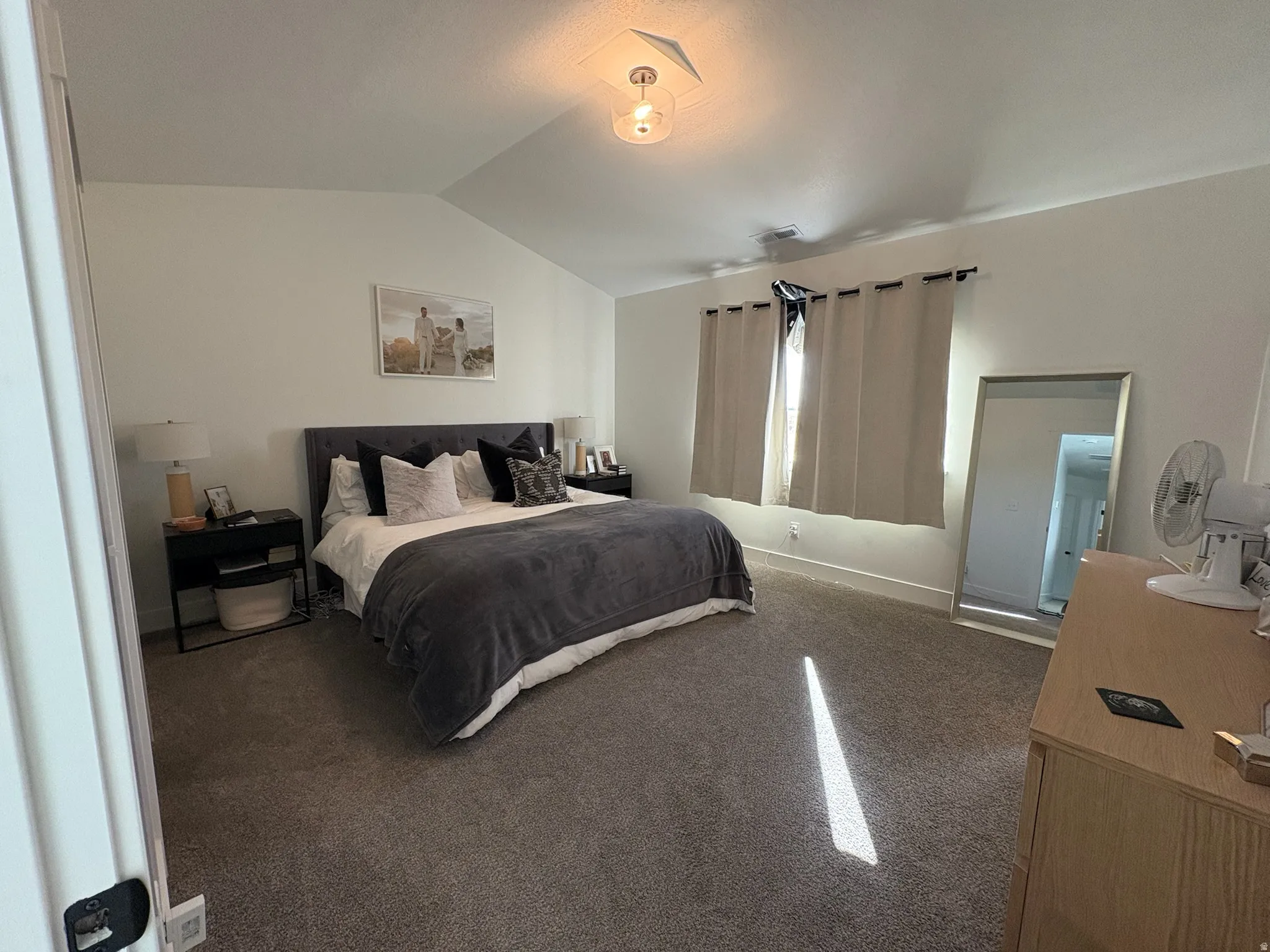 Bedroom with baseboards and carpet floors