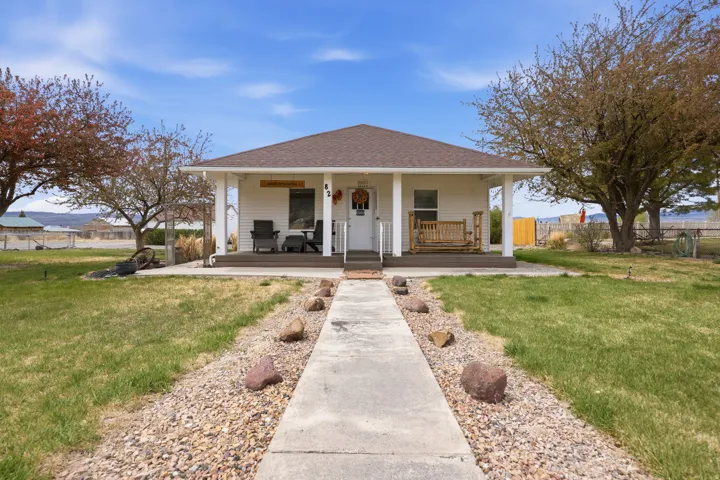Bungalow-style house with covered porch and roof with shingles