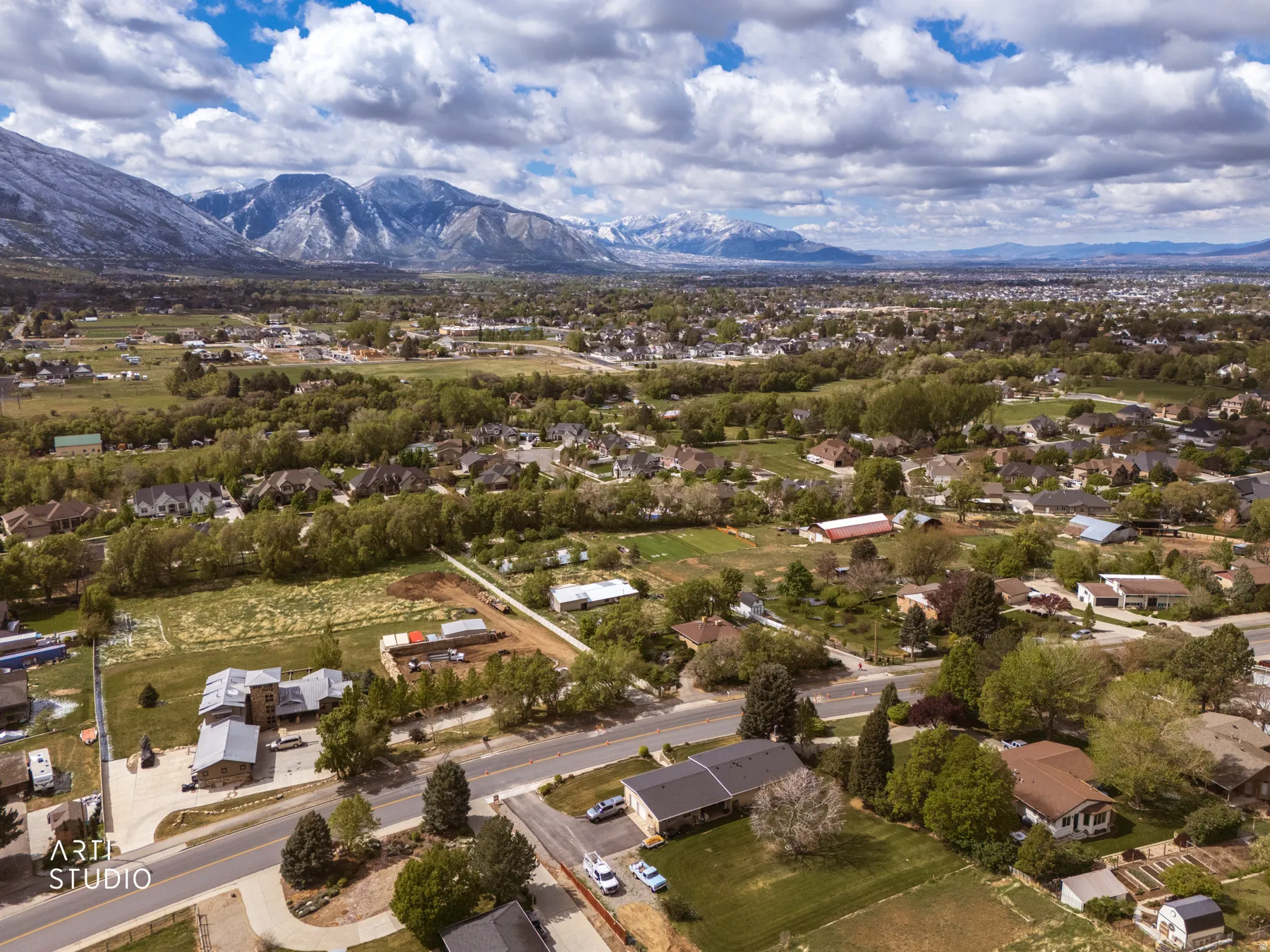 Aerial perspective of suburban area featuring a mountainous background