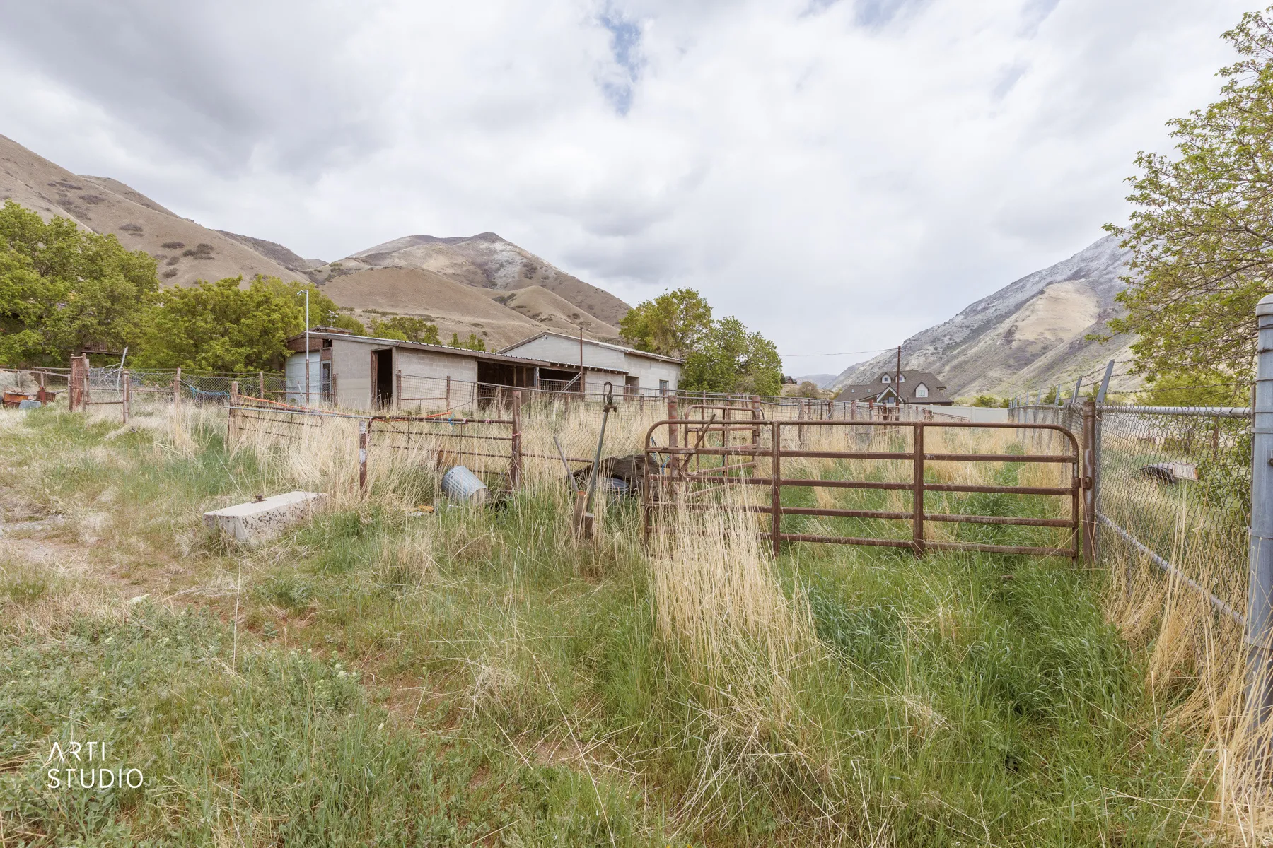 View of yard featuring a mountain view and an outbuilding