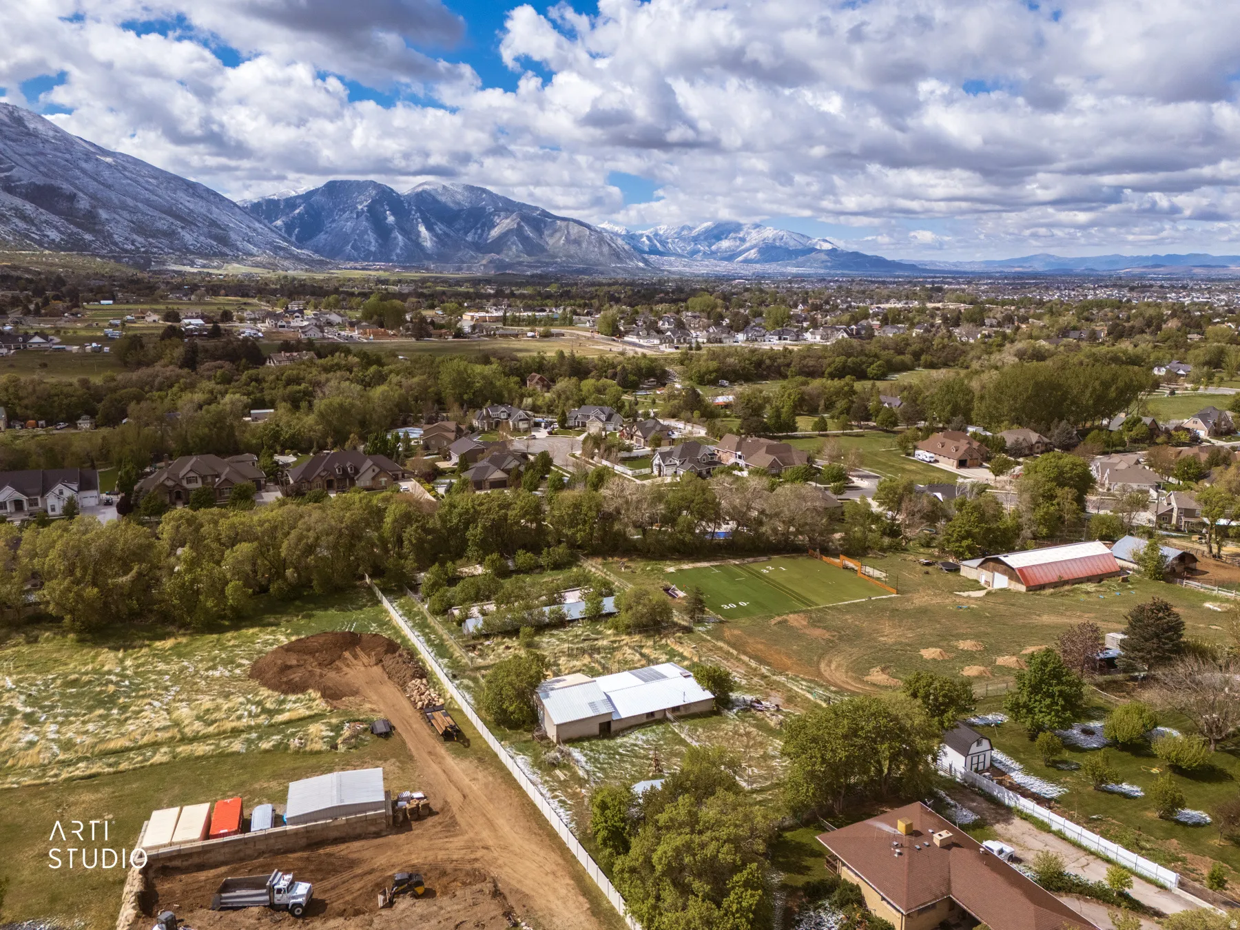 Aerial view of residential area featuring mountains