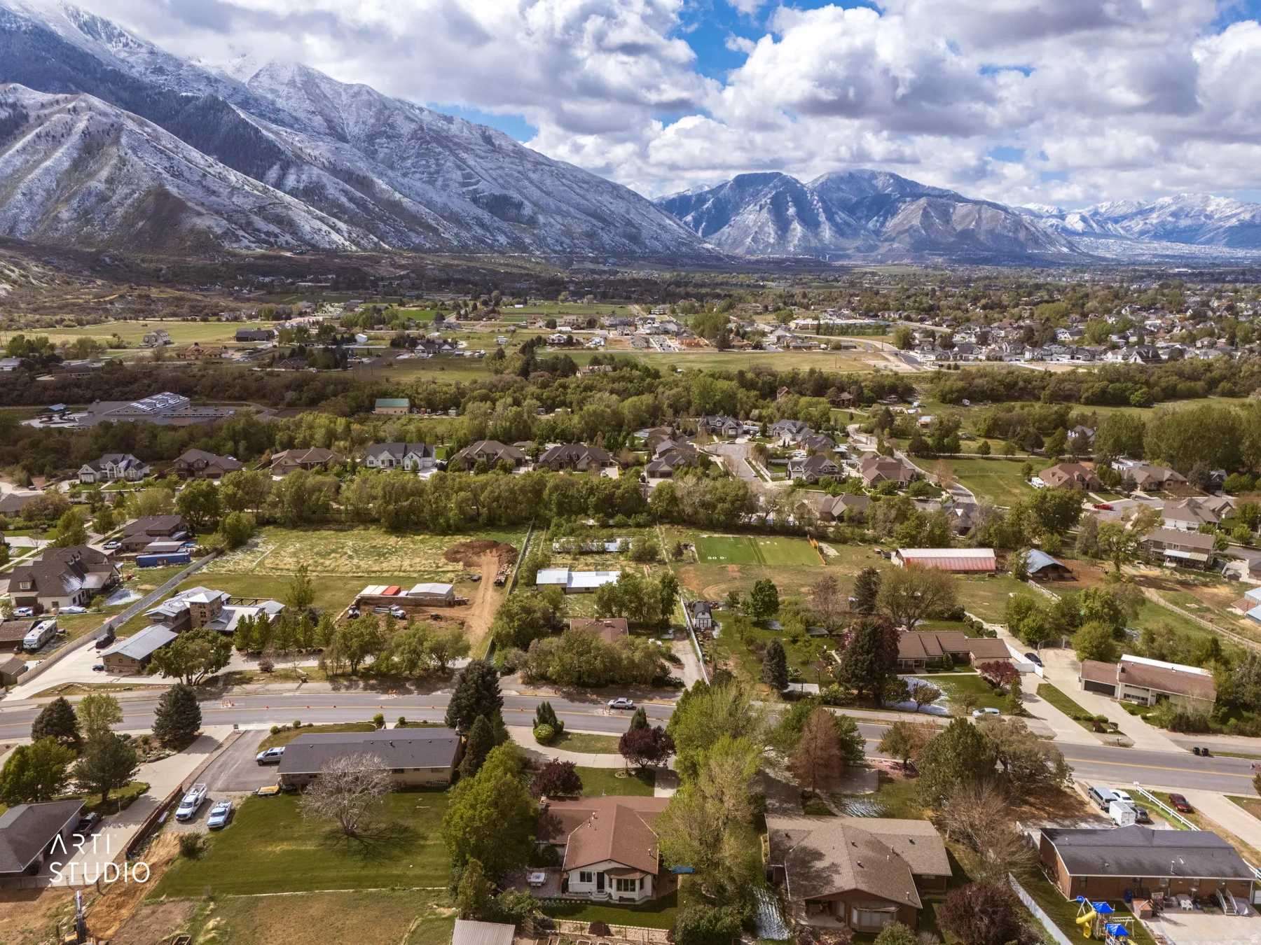 Aerial perspective of suburban area featuring a mountainous background