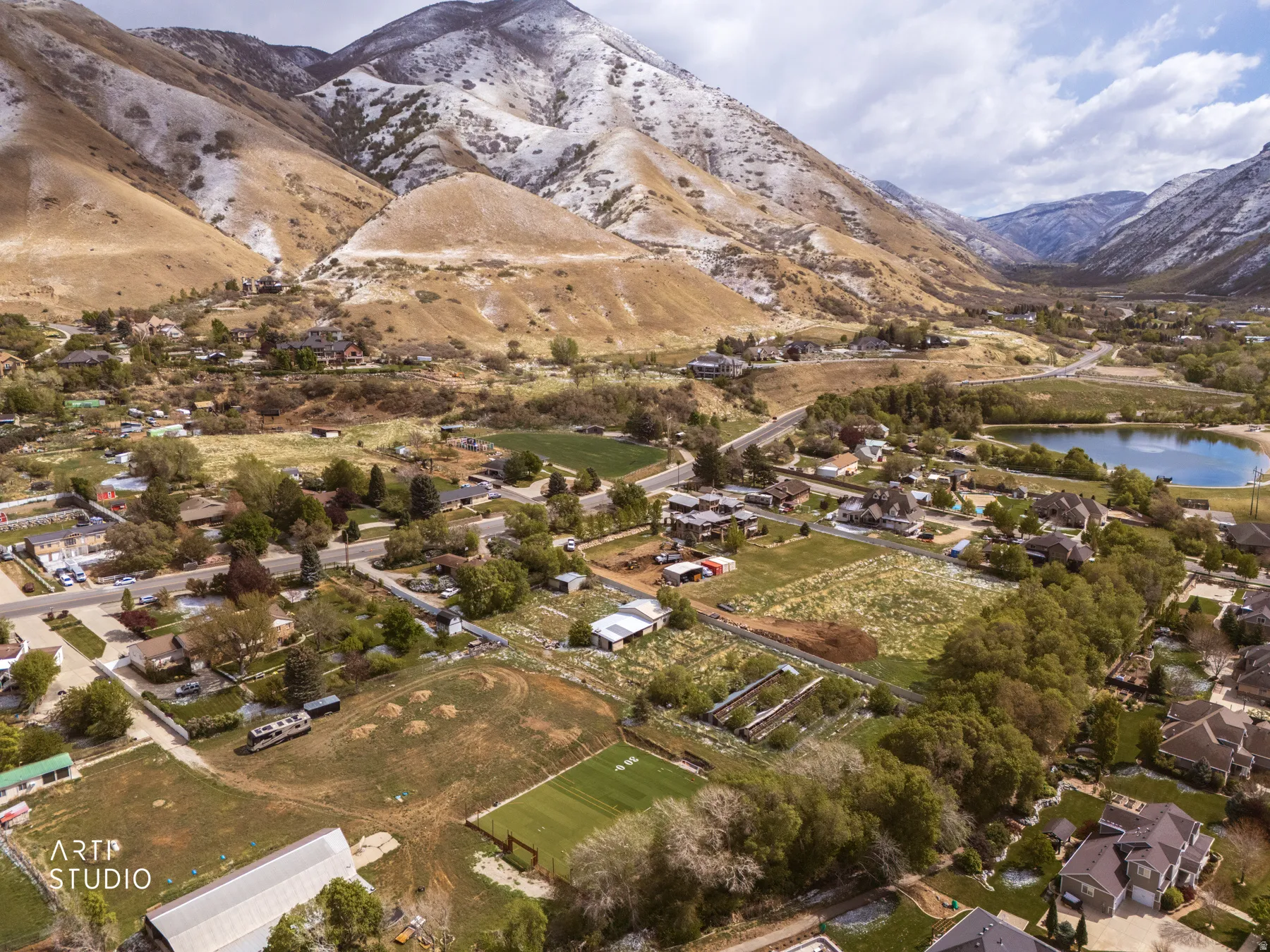 Aerial view of residential area with a water and mountain view
