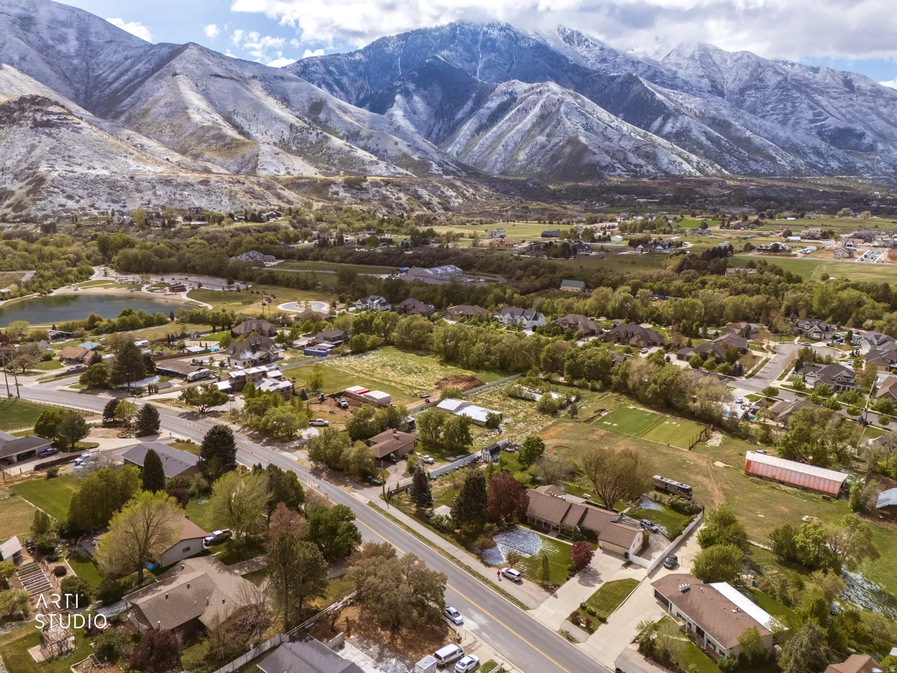 Aerial view of residential area featuring a mountainous background