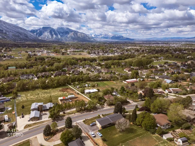 Aerial perspective of suburban area featuring a mountainous background