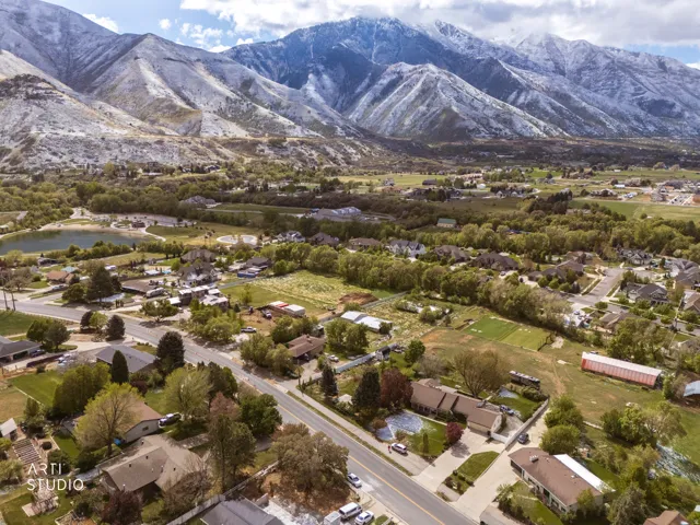 Aerial view of residential area featuring a mountainous background