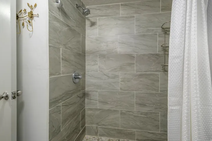 Full bath featuring a stall shower