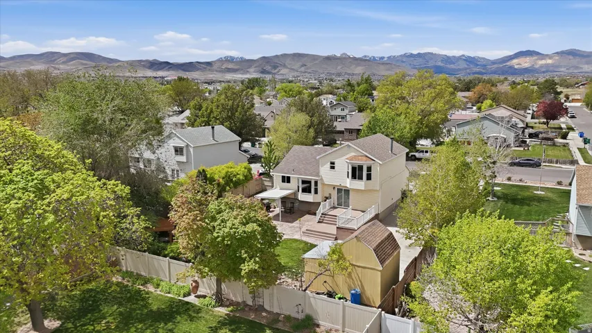 Aerial view of residential area featuring a mountain backdrop