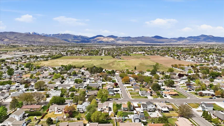 Aerial perspective of suburban area with a mountain backdrop