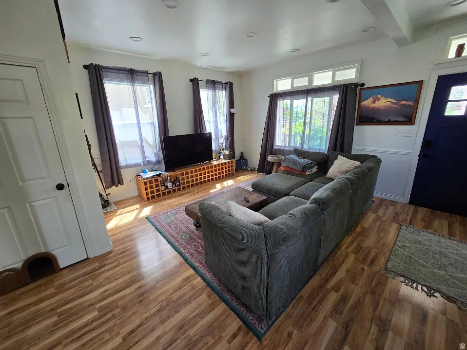 Living room with wood finished floors and plenty of natural light