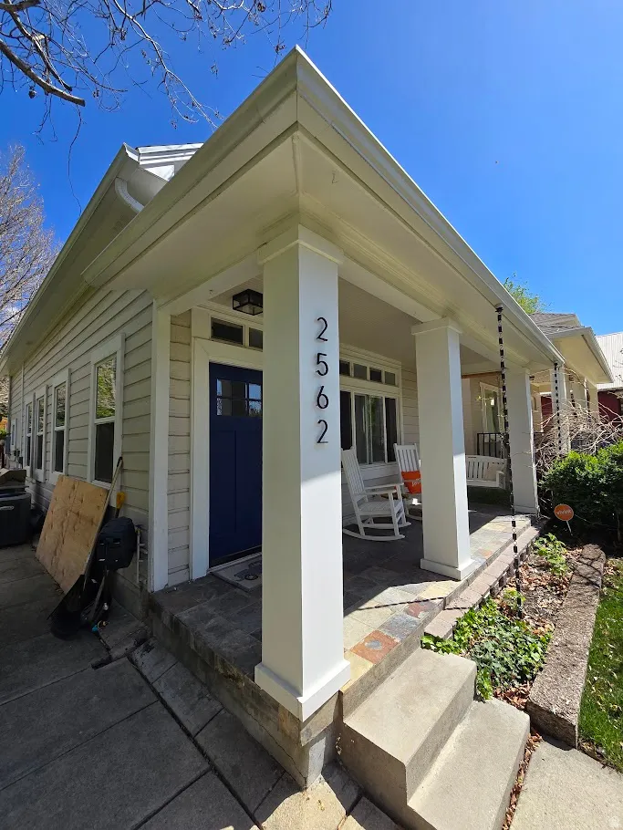 Entrance to property featuring covered porch