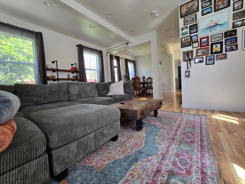 Living area featuring light wood-style floors and recessed lighting
