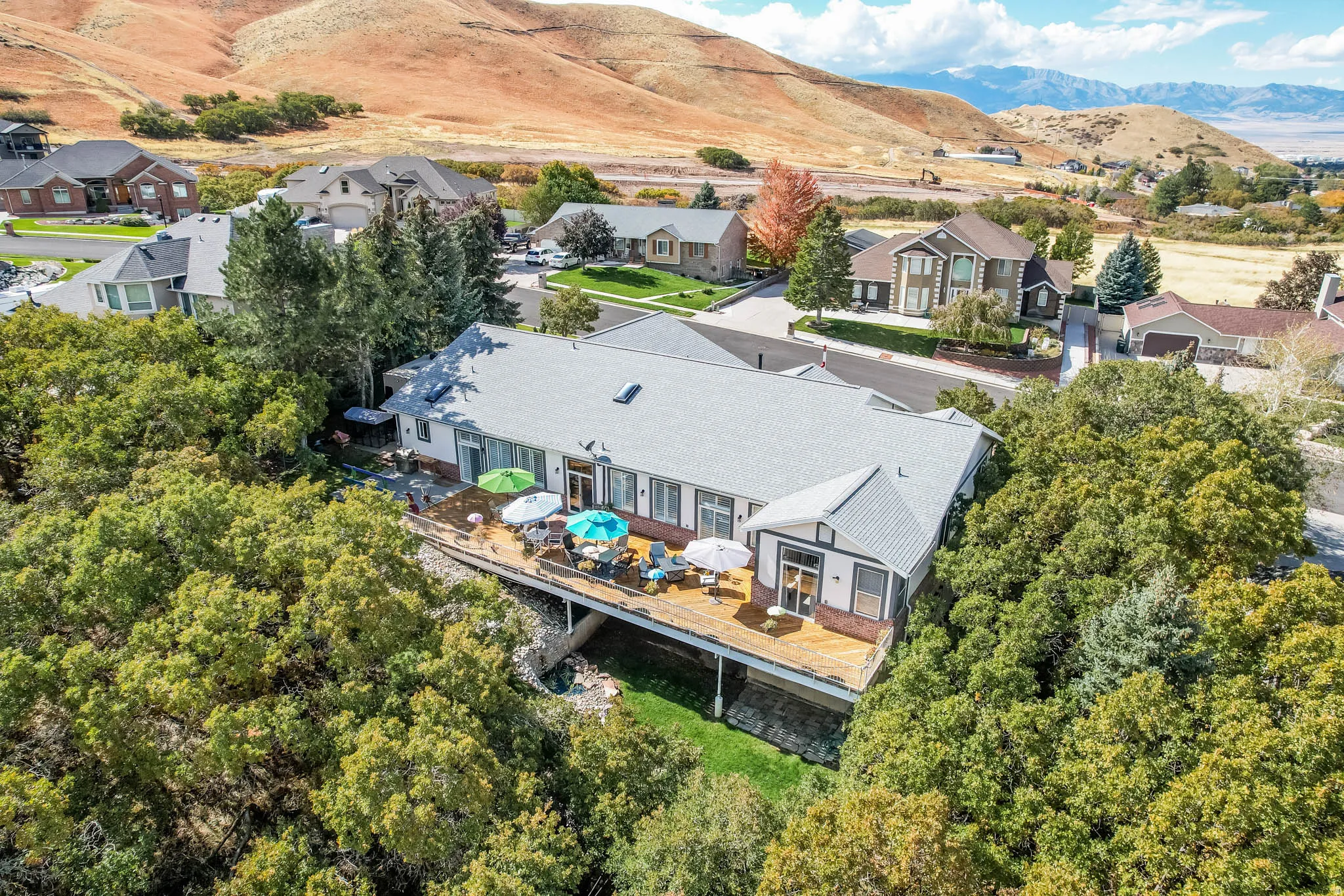 Aerial perspective of suburban area with a mountain backdrop