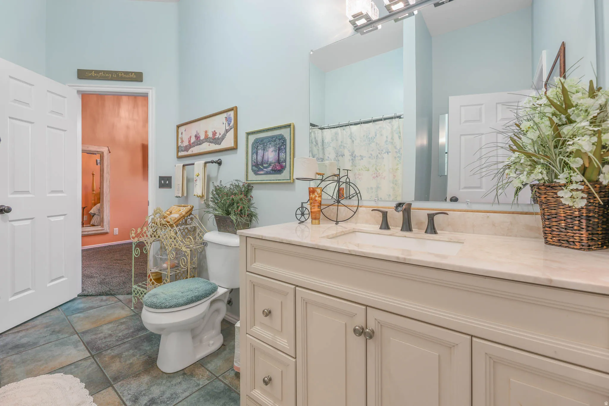 Full bath with vanity and curtained shower