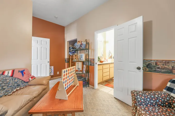Living area with light carpet