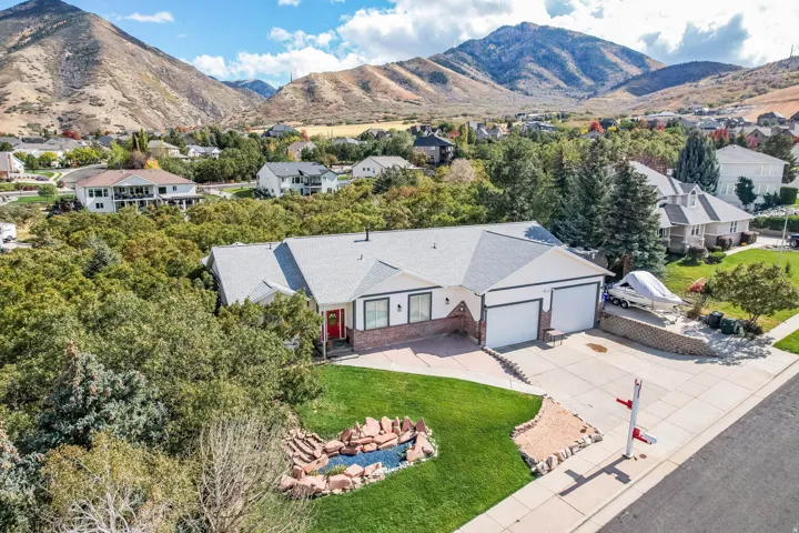 Aerial view of residential area featuring a mountain backdrop