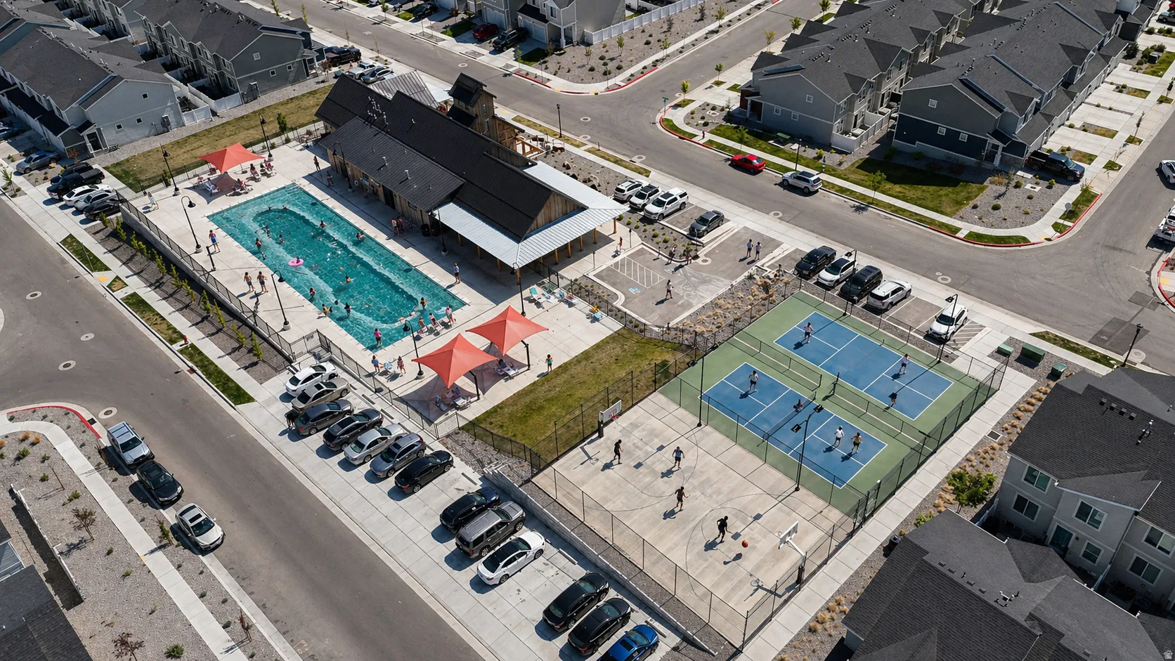 Aerial view of residential area featuring a pool