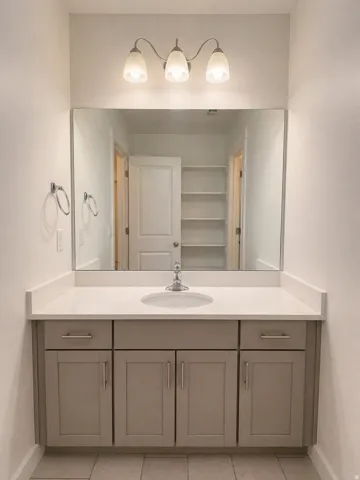 Bathroom featuring vanity and light tile patterned floors
