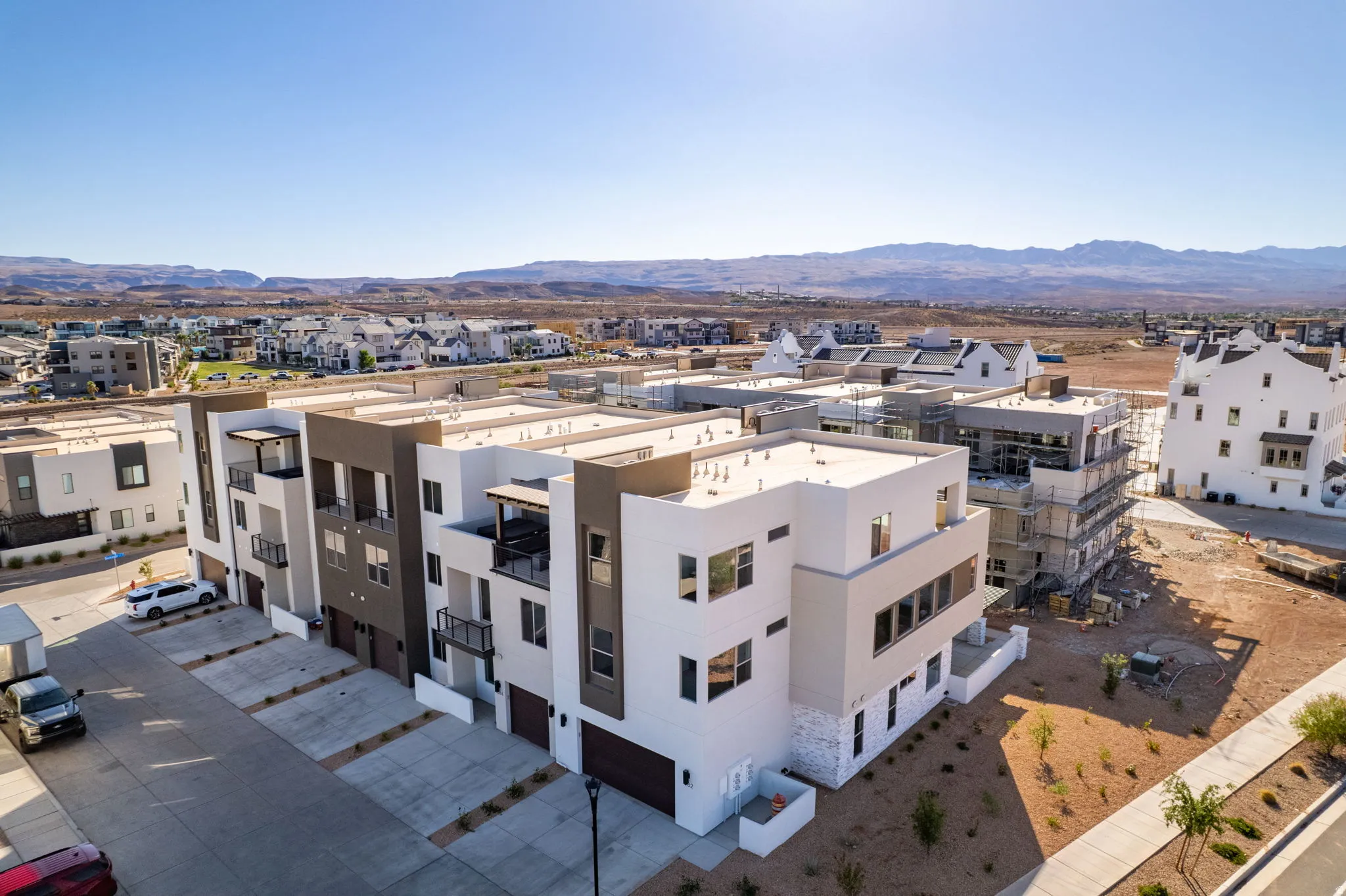 Modern multi-story residential buildings featuring clean lines and a contemporary color palette