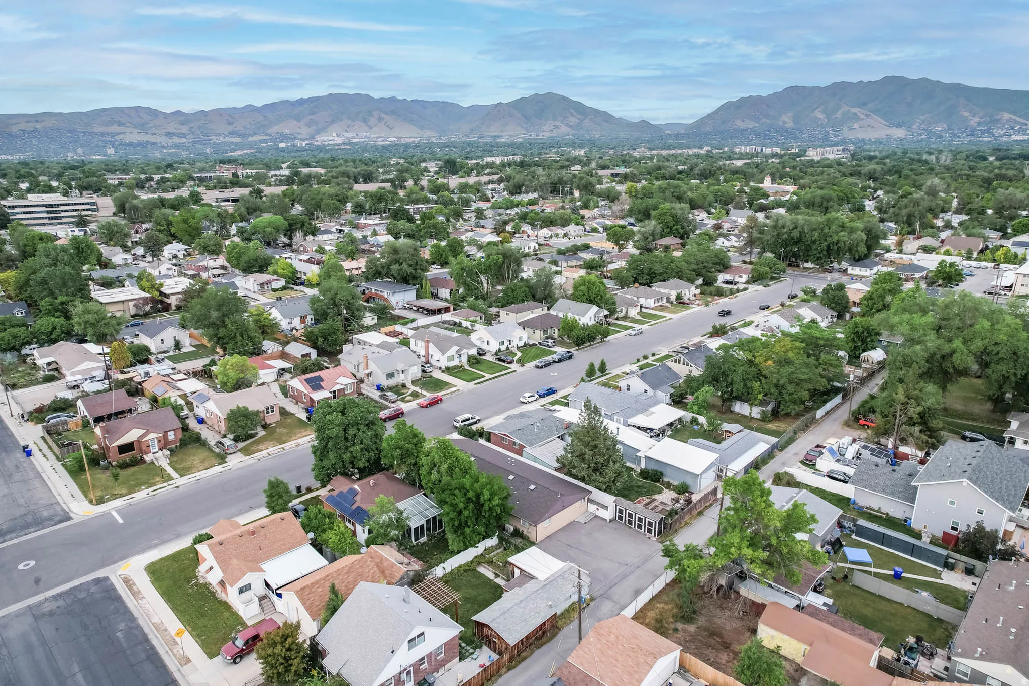 Aerial view of residential area featuring a mountain backdrop