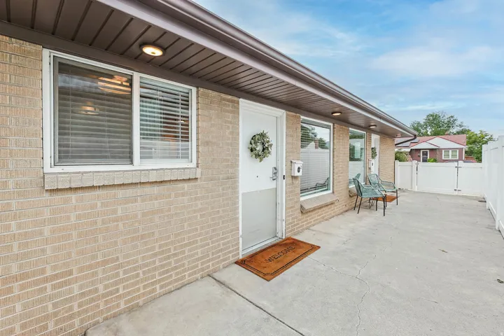 Entrance to property with brick siding