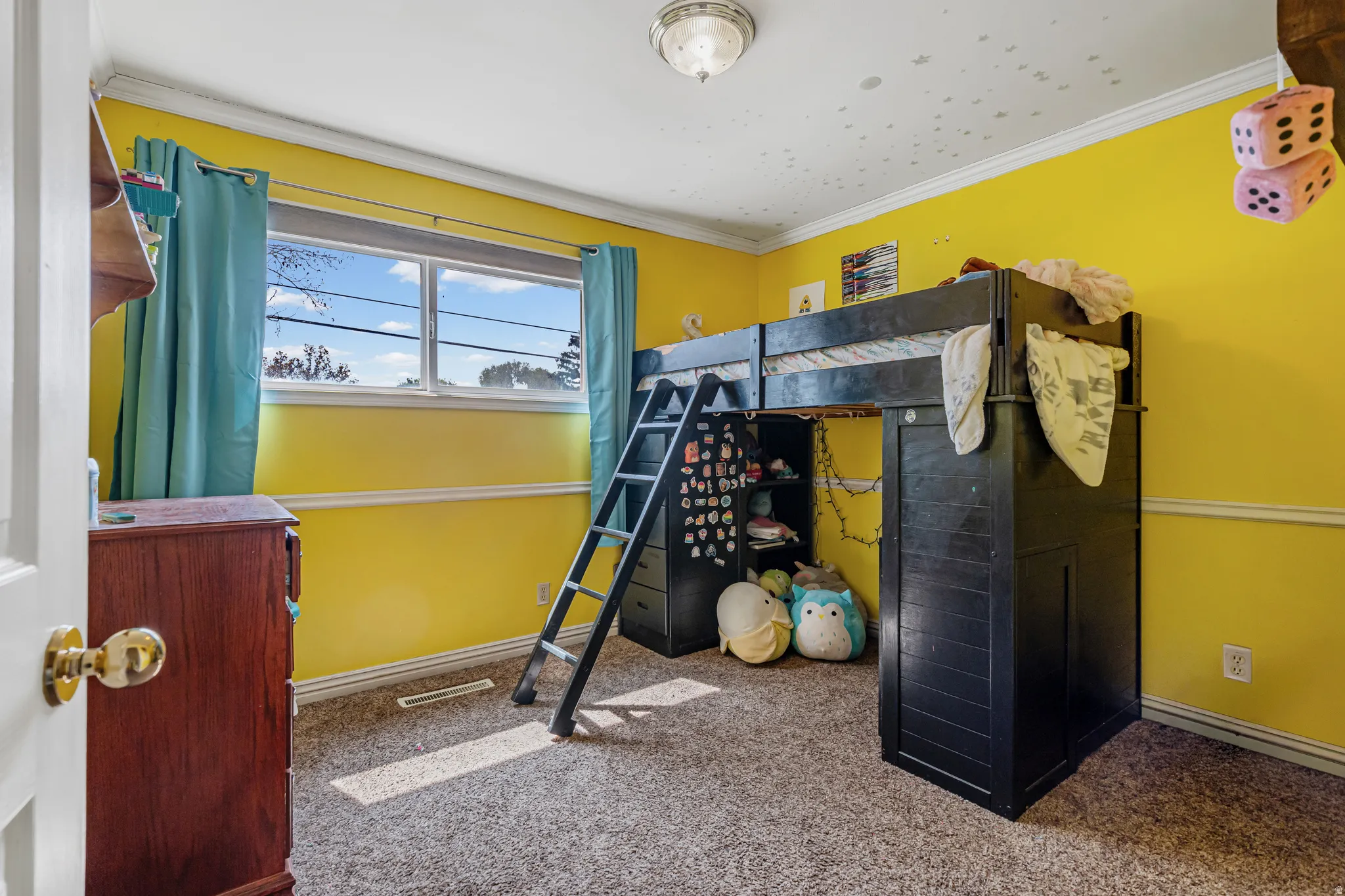 Carpeted bedroom with baseboards and ornamental molding
