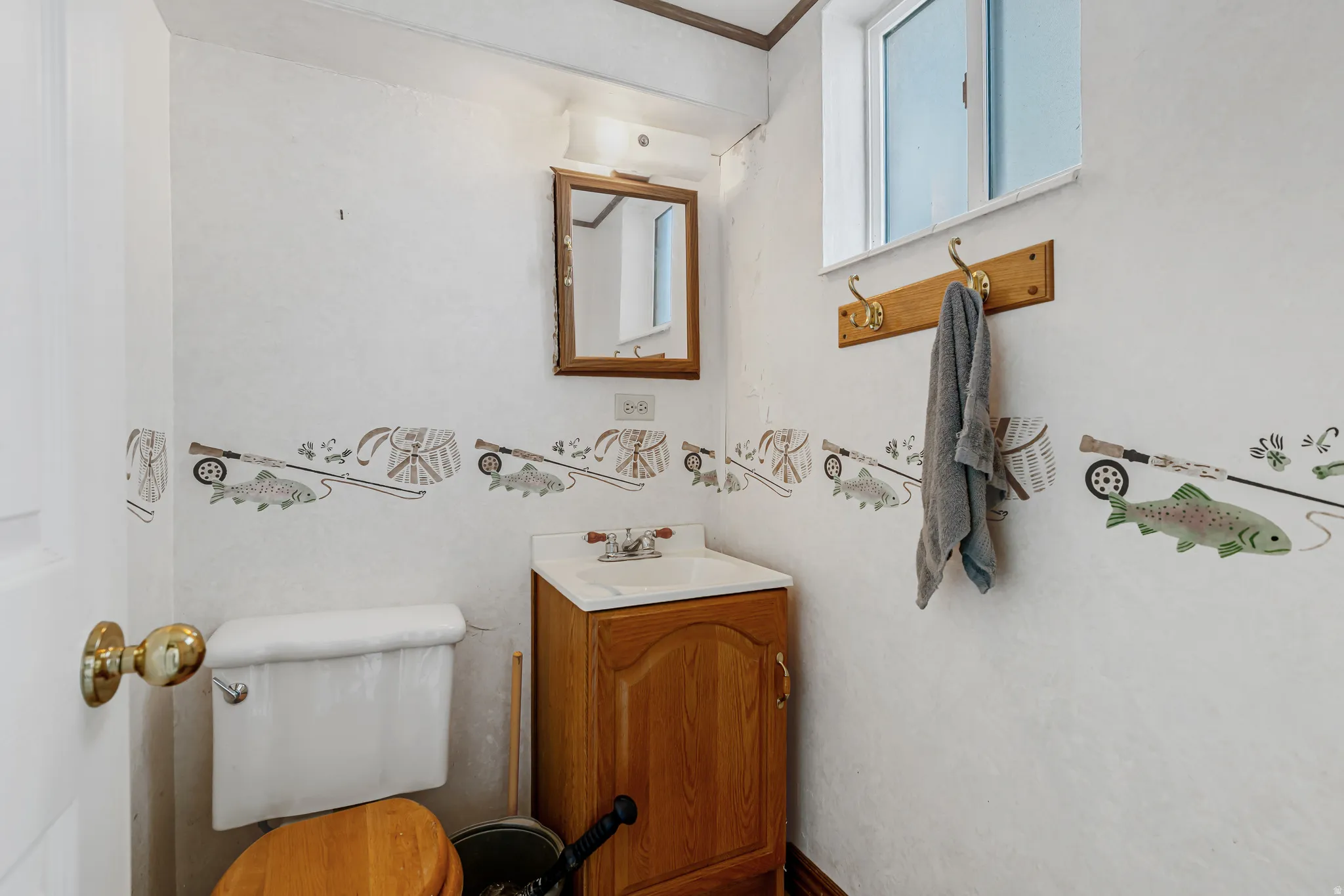 Half bath with vanity and toilet