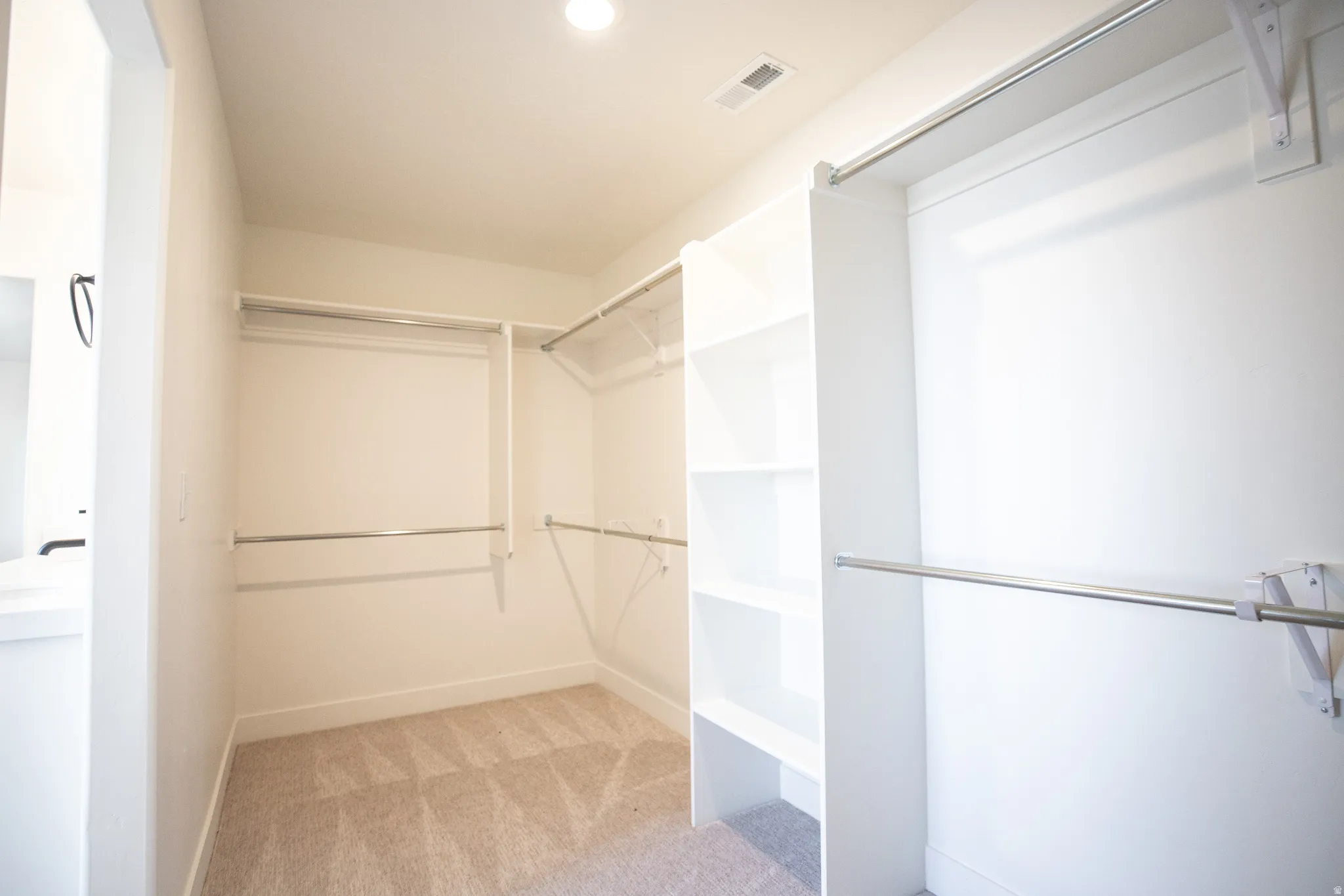 Walk-in closet for primary bedroom