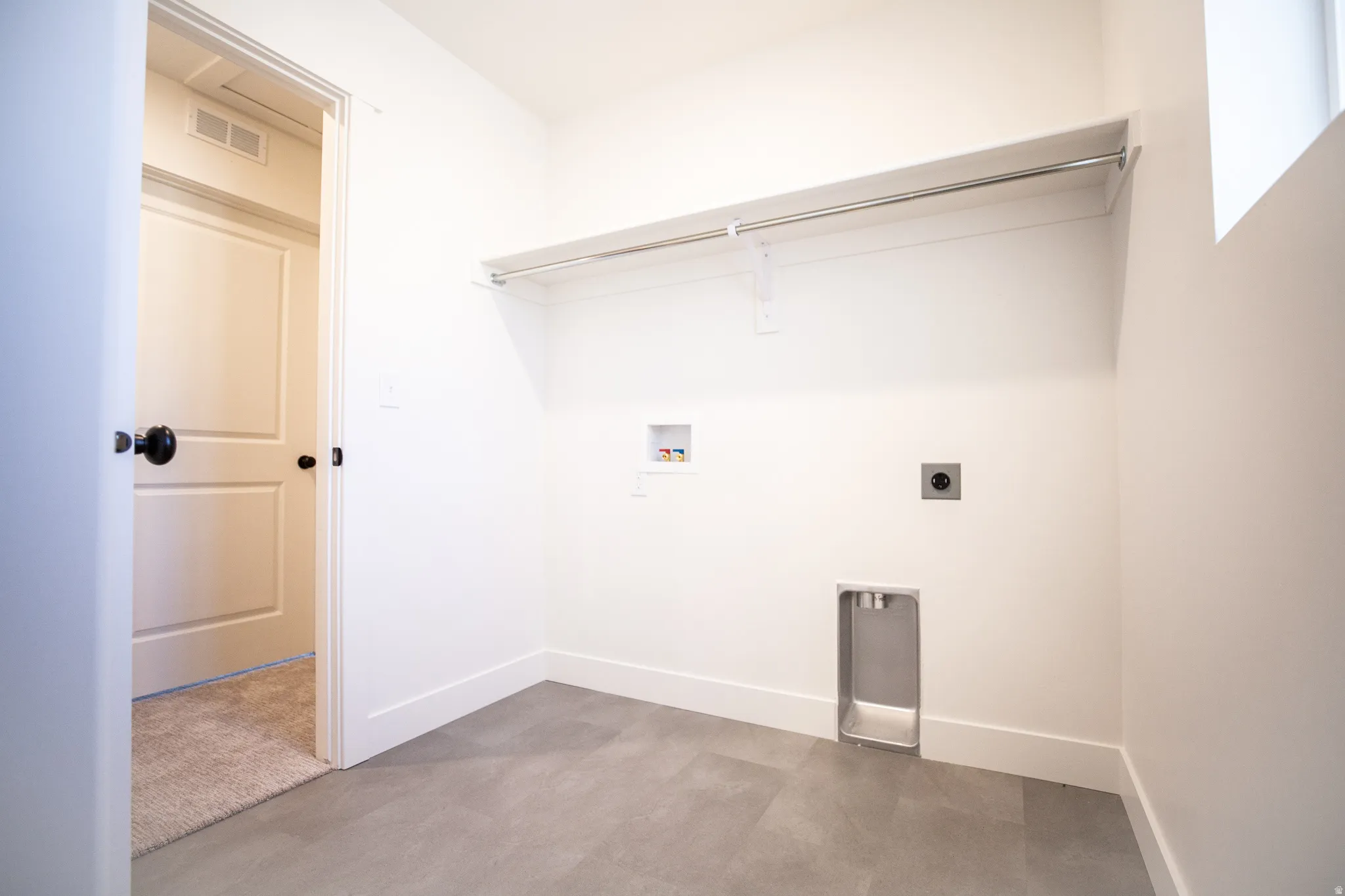 Laundry room with hookups for an electric washer and dryer