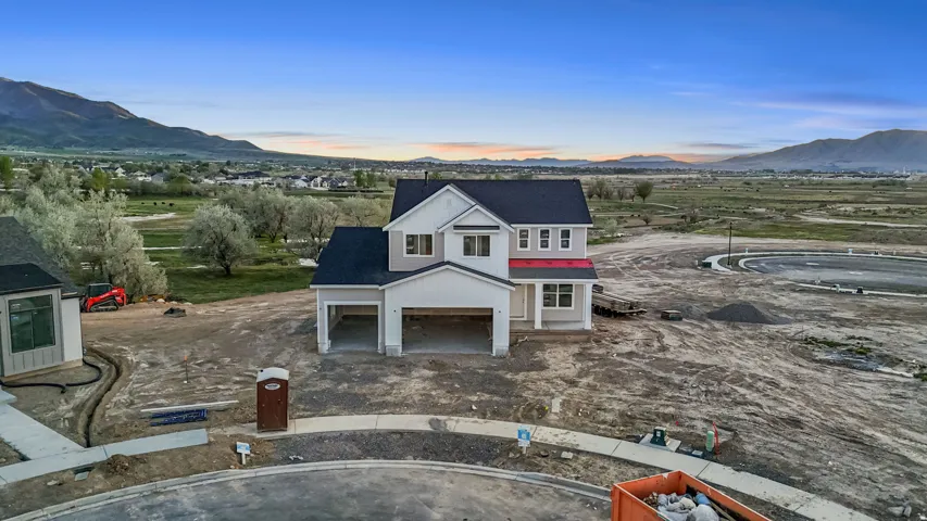 View of front of property with a mountain view and covered porch