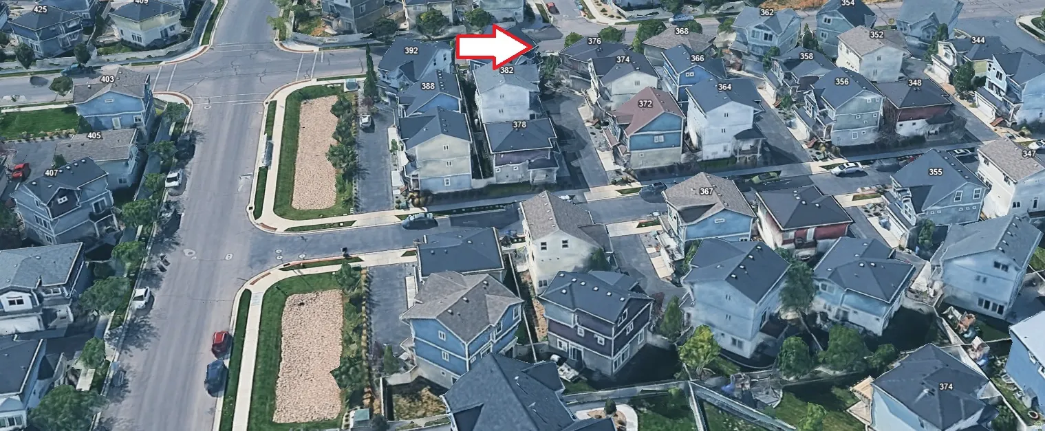 Aerial view of property and surrounding area with nearby suburban area