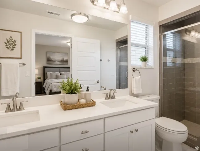 Dual sink vanity with white countertops and cabinetry