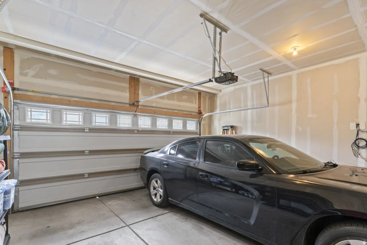 Garage featuring a garage door opener