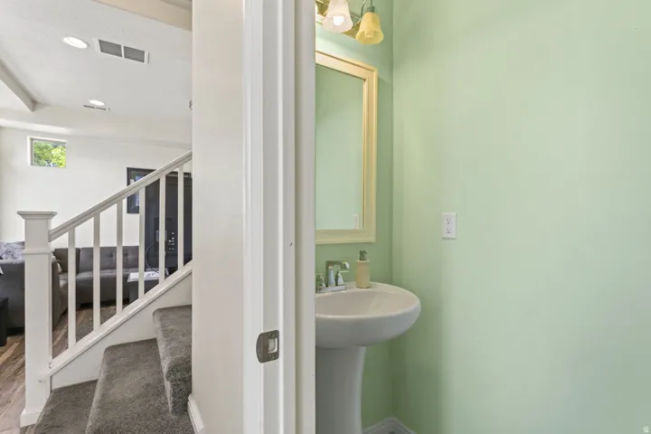 Bathroom with recessed lighting and a sink
