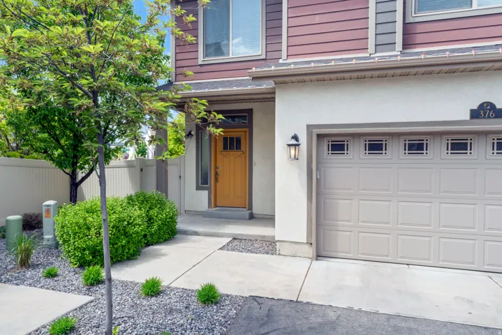 Brown siding exterior with a cream stucco finish