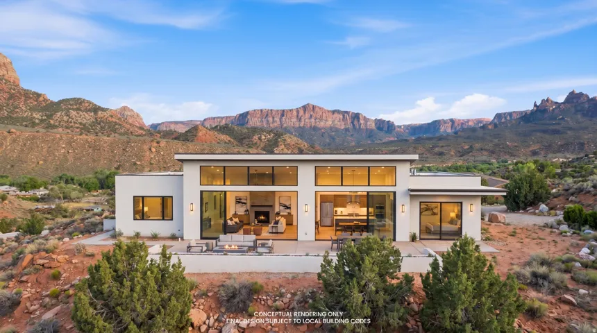 Back of property featuring a mountain view, a patio, and stucco siding
