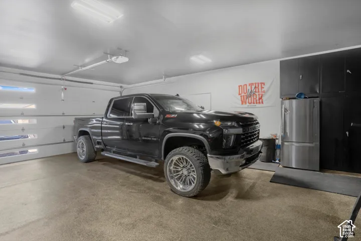 Garage with freestanding refrigerator