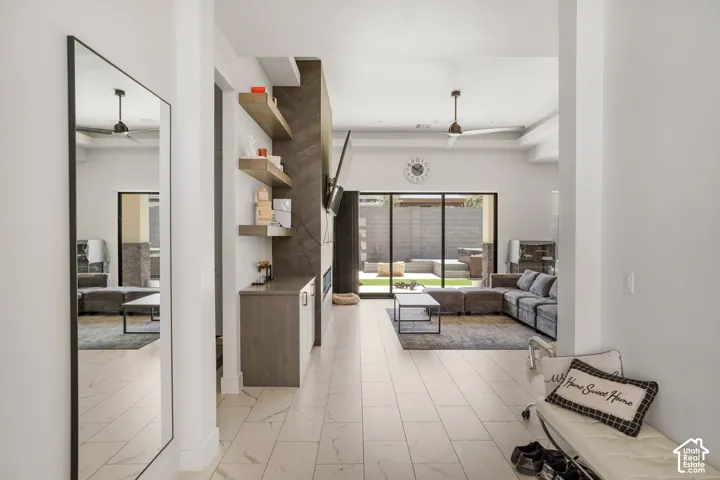 Living area featuring a ceiling fan