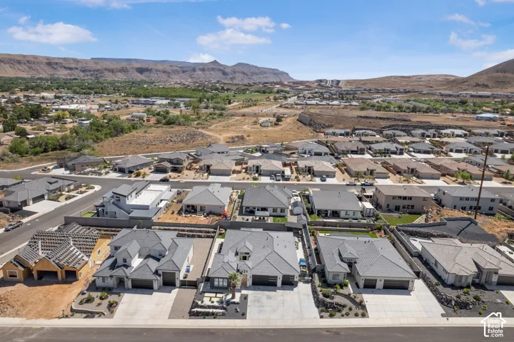 Aerial view of residential area with a mountainous background