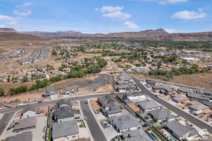 Aerial perspective of suburban area featuring a mountainous background