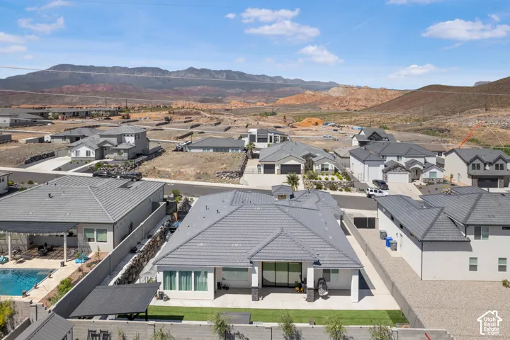 Aerial view of residential area featuring a mountain backdrop