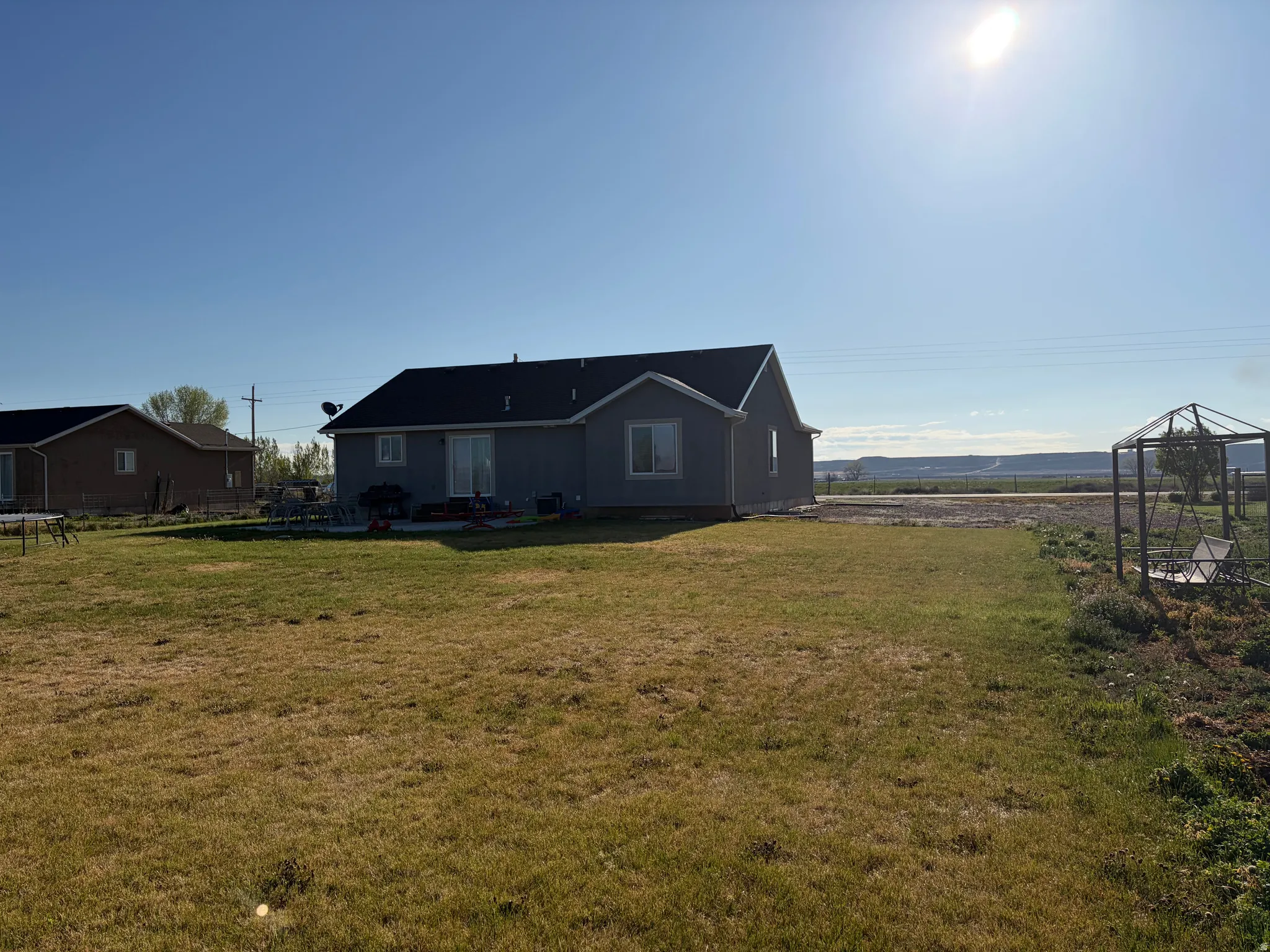 Back of property featuring a yard