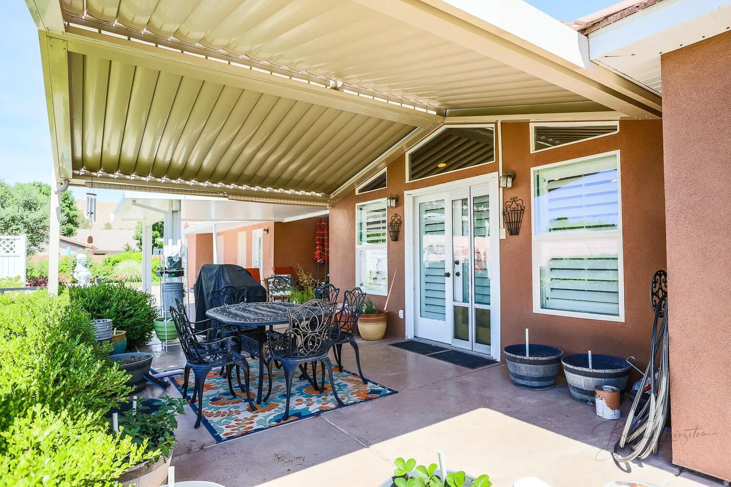 View of patio featuring outdoor dining space and a grill